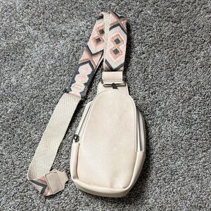 Elegant Beige Crossbody Bag with Patterned Strap